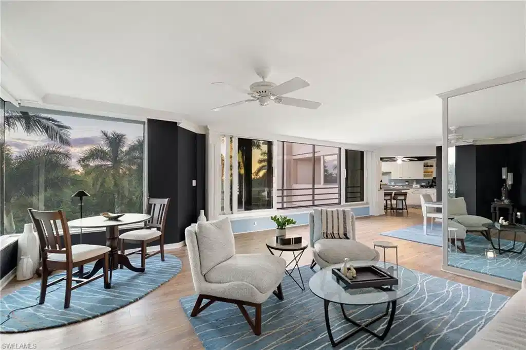 Image 1: Oversized windows on three sides of the unit (including two walls nearly all glass), this light, bright & airy CORNER UNIT is brimming with natural light.