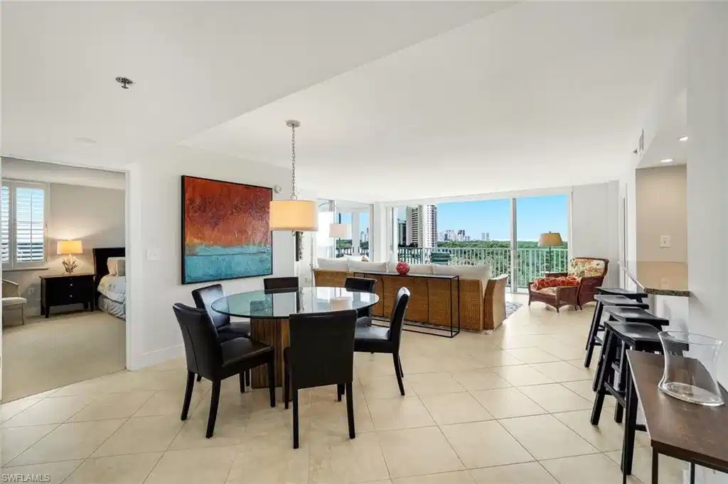 Image 1: Dining room featuring a view of skyline, recessed lighting, and expansive windows