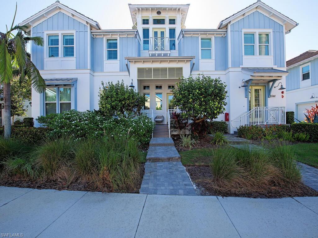 Image 1: View of front of property featuring board and batten siding