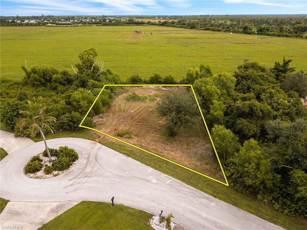 Image 1: Aerial view of property's location featuring property parcel outlined