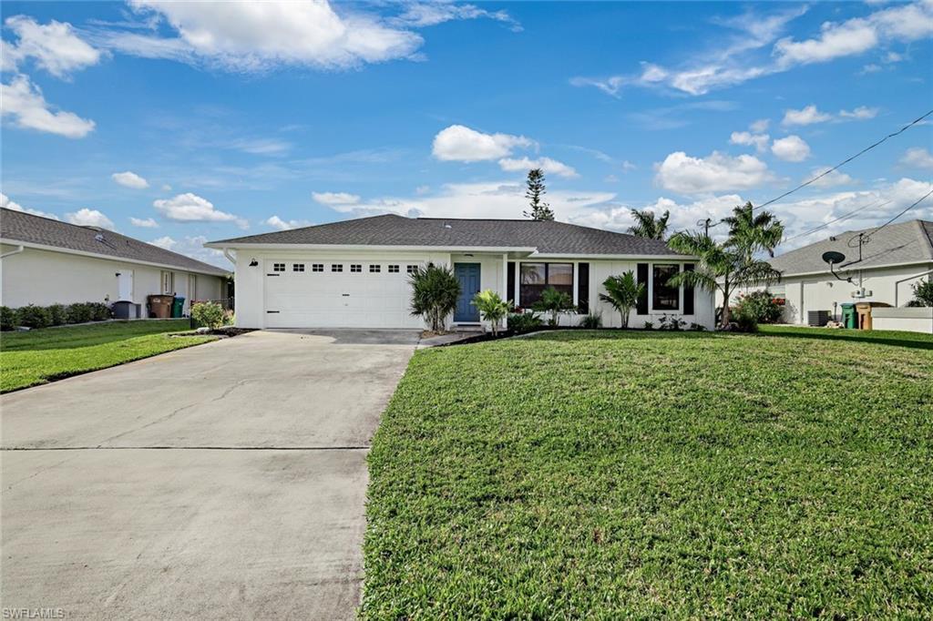 Image 1: Single story home featuring a front lawn, concrete driveway, a garage, and stucco siding