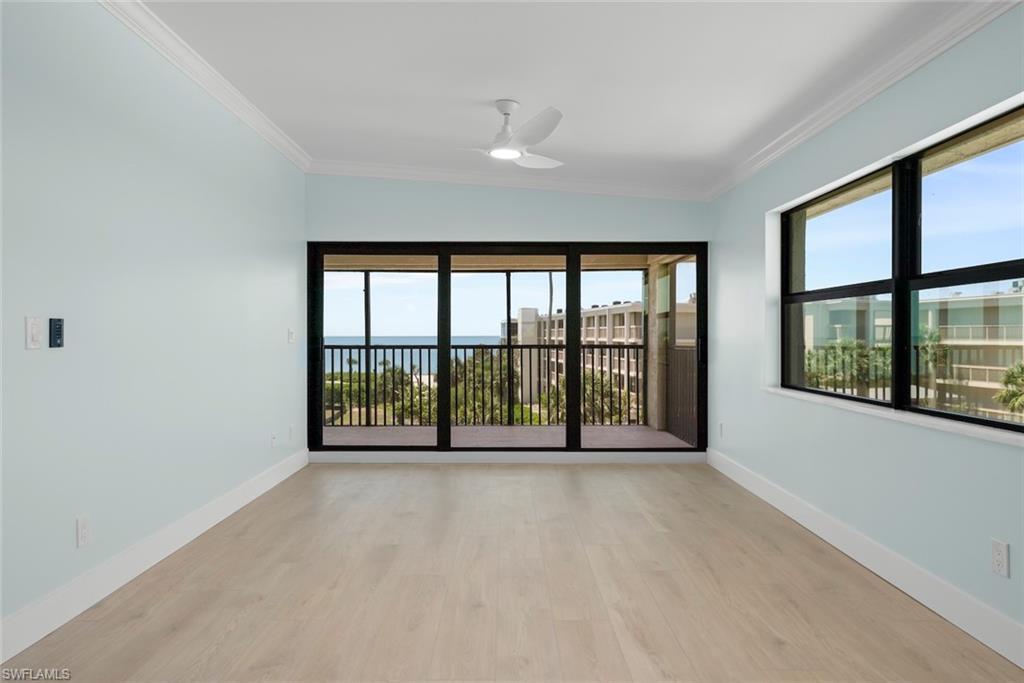Image 4: The property features light-toned flooring, light blue walls, and a ceiling fan