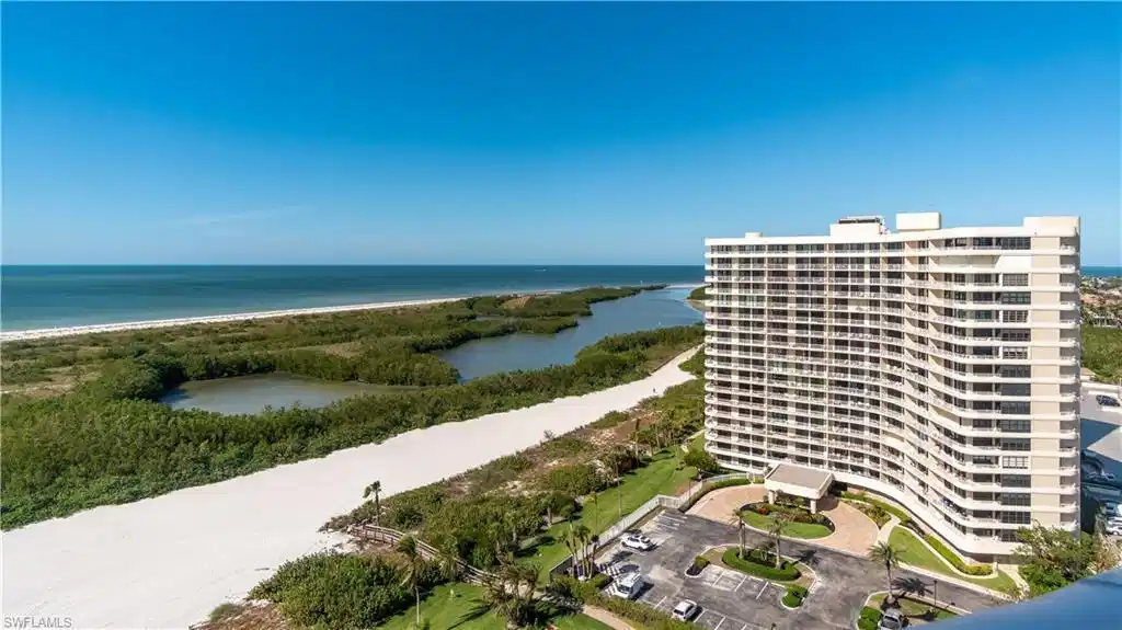 Image 1: The property offers expansive views of the ocean, a white sand beach, and natural waterways