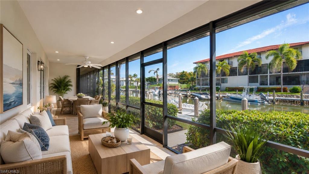 Image 2: Screened lanai featuring a dining area, recessed lighting, and a ceiling fan