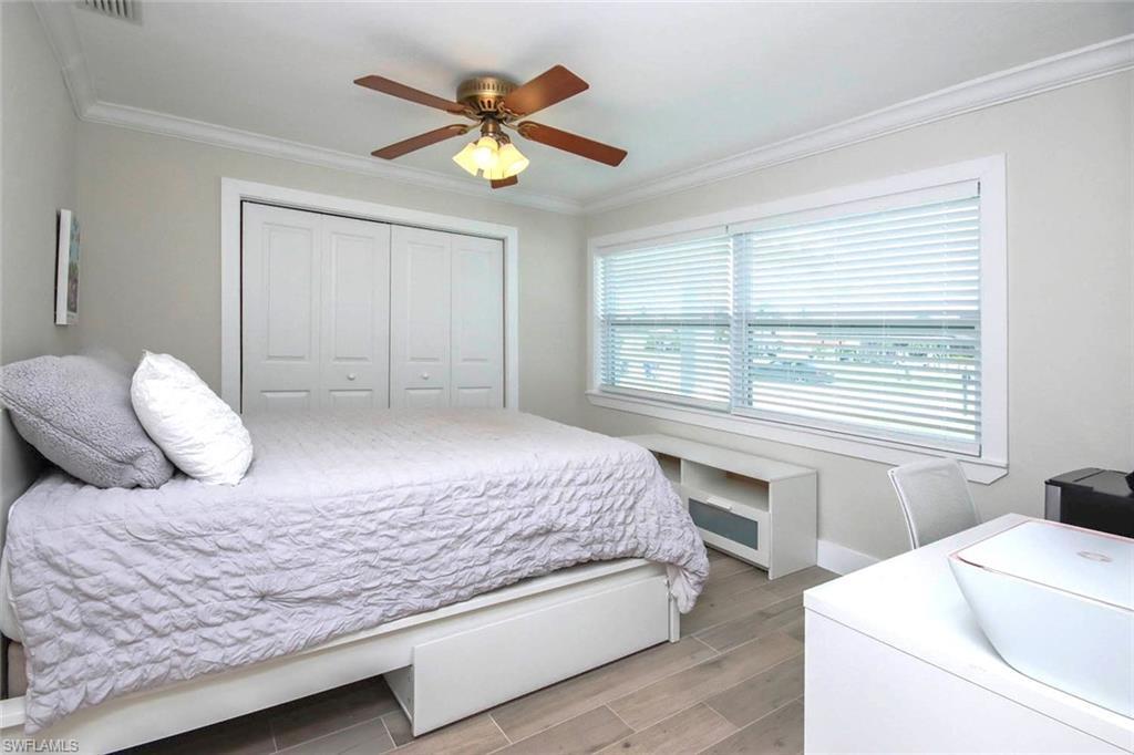 Image 4: Living room featuring ornamental molding, recessed lighting, light wood-style floors, and a ceiling fan