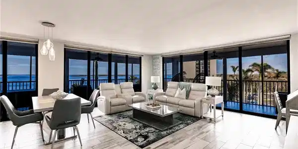 Image 2: Living room featuring a water view, expansive windows, and ceiling fan