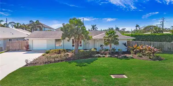 Image 3: Single story home featuring concrete driveway, an attached garage, and stucco siding