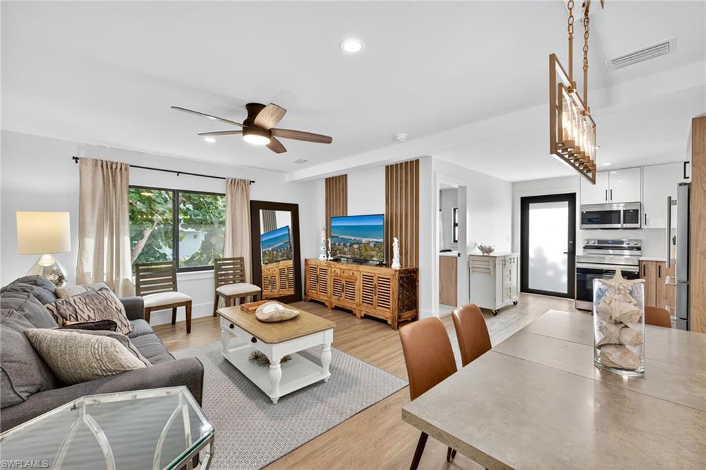 Image 2: Living room featuring a ceiling fan, light wood finished floors, and recessed lighting