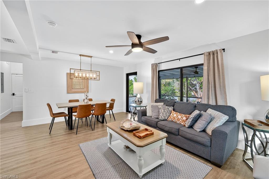 Image 4: Living area featuring light wood-style flooring, recessed lighting, and ceiling fan