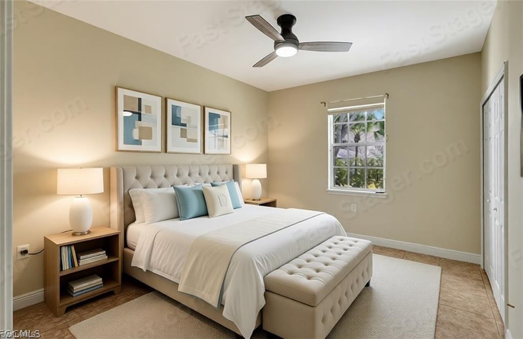 Image 4: Living room featuring crown molding, a ceiling fan, a tray ceiling, and light tile patterned flooring