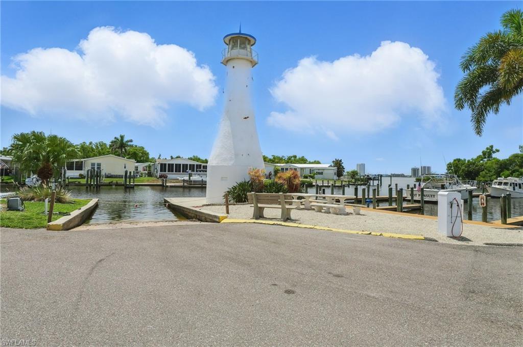 Image 2: View of community featuring a boat ramp, a boat dock, and a water view
