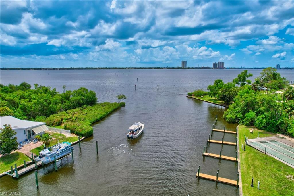 Image 3: Water view with a dock