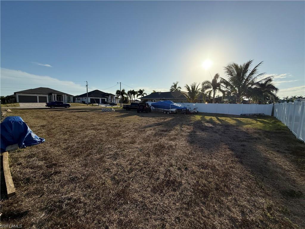 Image 4: Fenced yard with a residential view