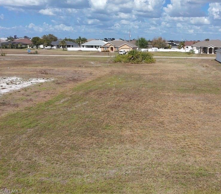 Image 2: View of yard with a residential view