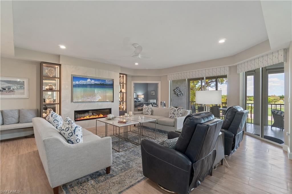 Image 3: Spacious living area with fireplace to warm you up when needed.