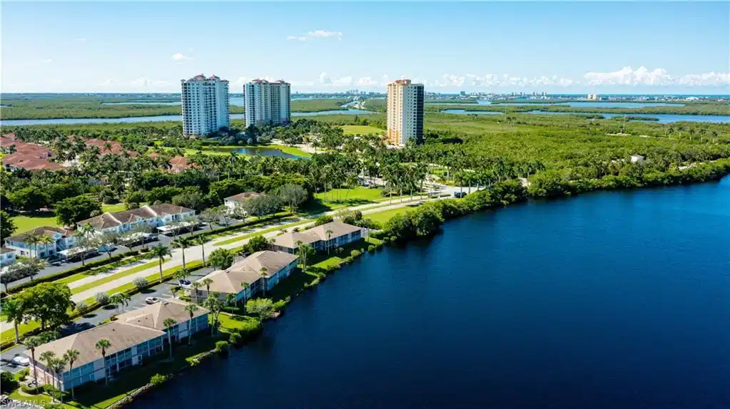 Image 1: Waterfront community featuring high-rise buildings and multi-story residences