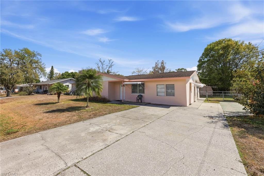 Image 3: Single story home featuring driveway and stucco siding