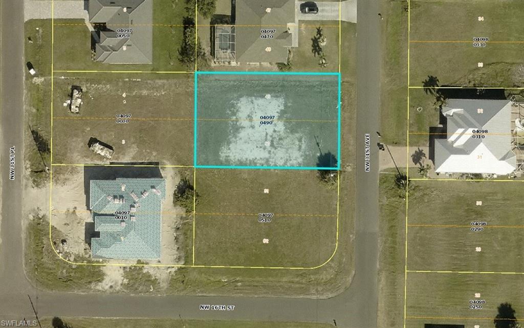 Image 1: Aerial overview of property's location featuring property parcel outlined