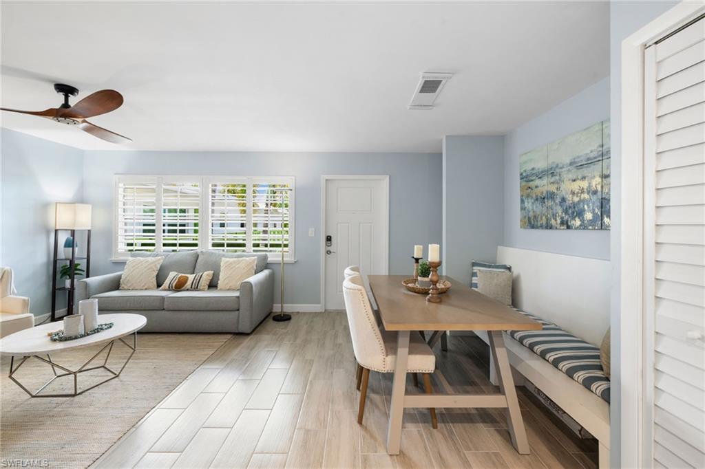 Image 3: Dining area featuring light wood-type flooring and ceiling fan