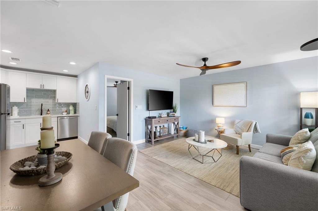 Image 4: Living area featuring a ceiling fan, light wood-style floors, and recessed lighting