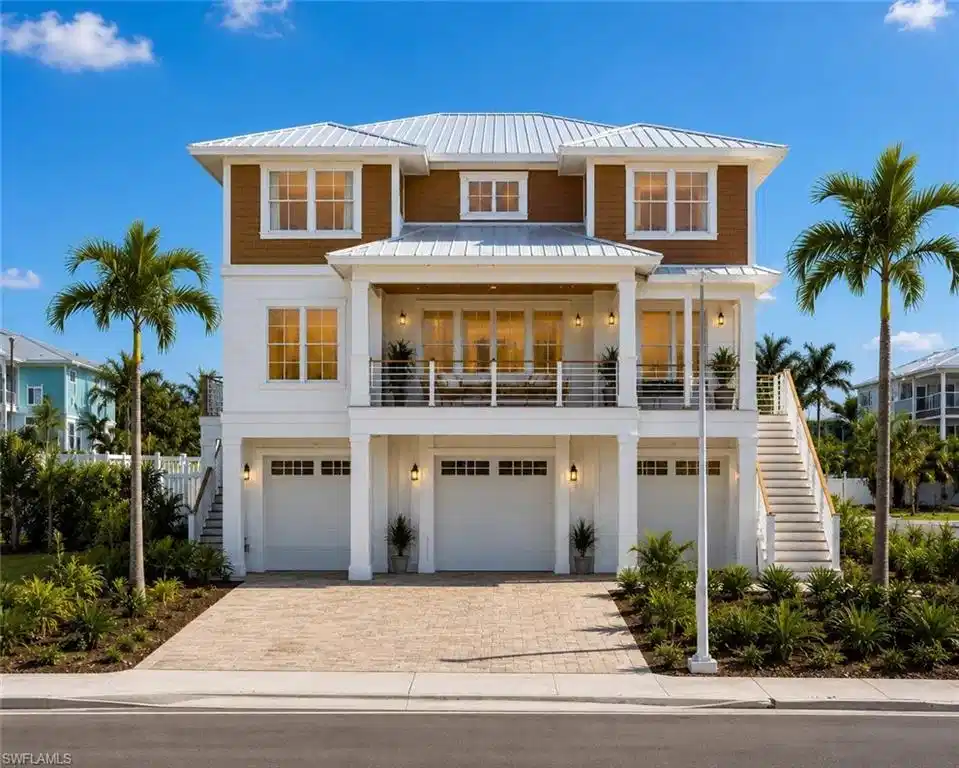 Image 1: RENDERING - Coastal-inspired exterior with white siding and shingle accents