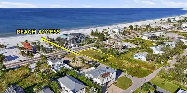Image 2: Aerial view of property's location featuring expansive coastline and property boundaries highlighted - Virtually Edited Image
