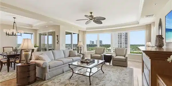 Image 2: Spacious open-concept living and dining area filled with natural light and panoramic views.