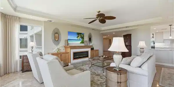 Image 4: Inviting living room featuring abundant natural light and beautiful views.