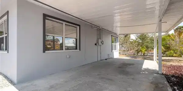 Image 3: View of patio / terrace featuring a carport