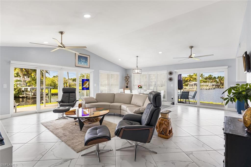 Image 3: Porcelain tile 24" x 24" set on diagonal throughout home.  Window coverings are remote controlled blinds.  Volume ceilings and recessed lights are great features.