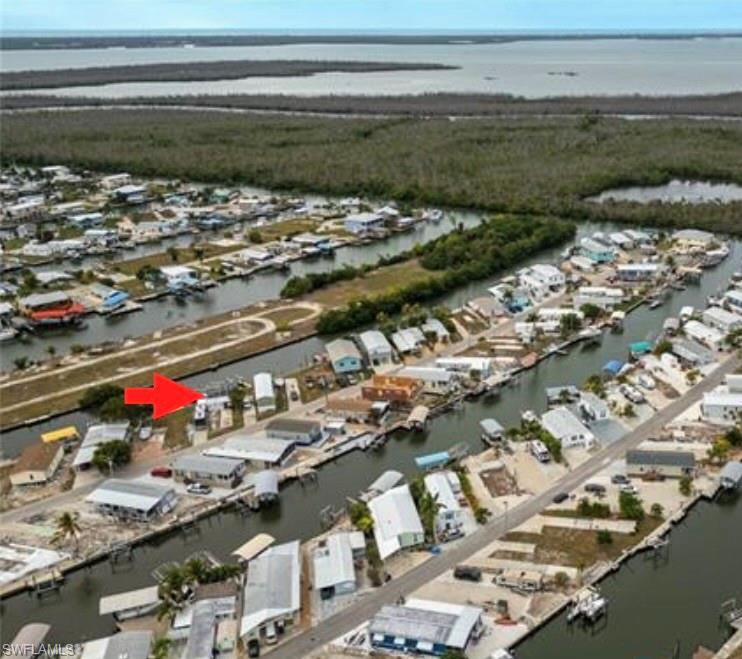 Image 1: Aerial view of canal front neighborhood in St. James City.
