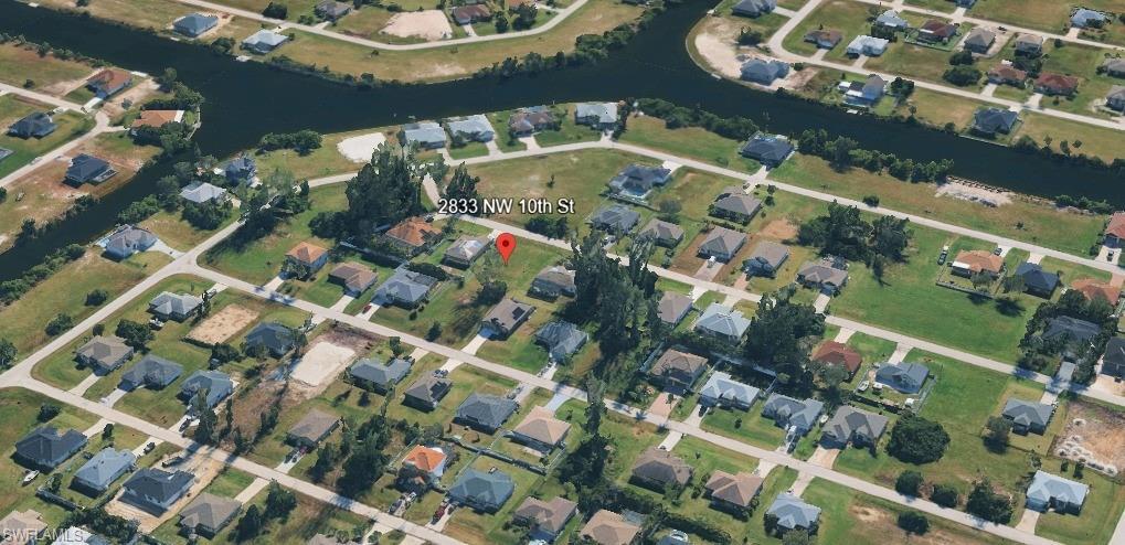 Image 2: View of property location featuring nearby suburban area