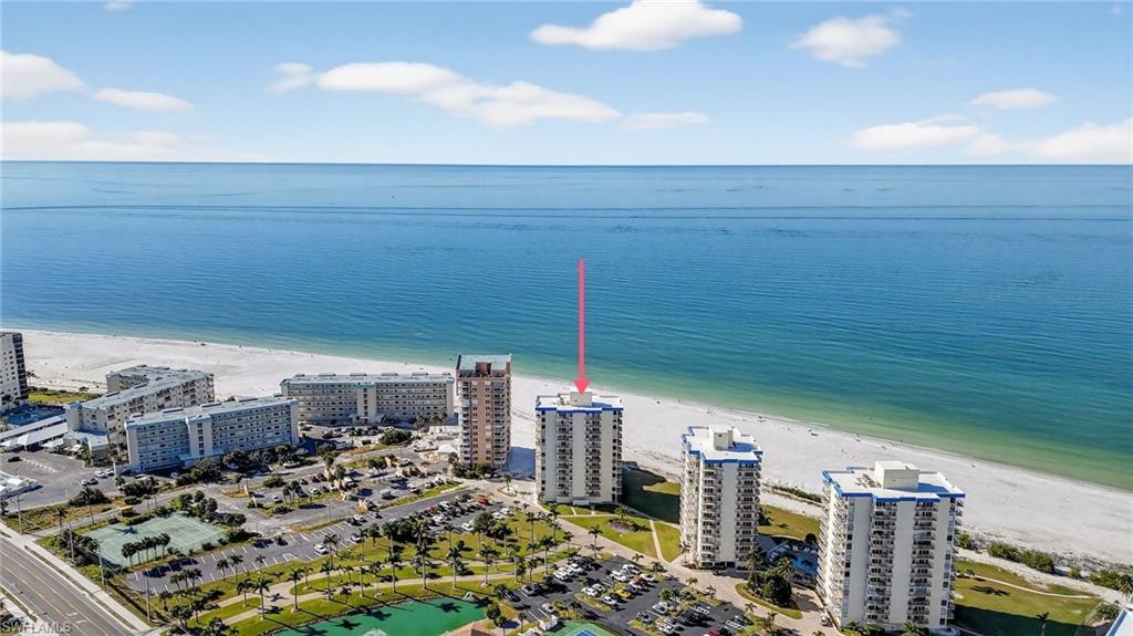 Image 2: Drone / aerial view of expansive coastline and apartment complex / building