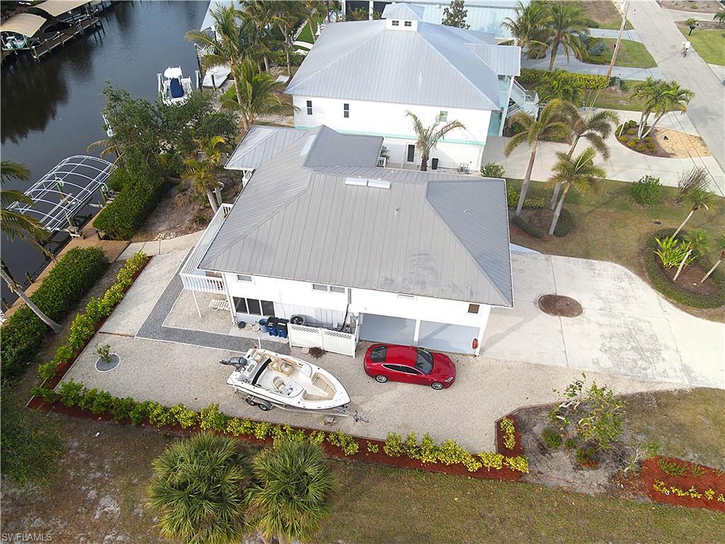 Image 4: View from above of property featuring a large body of water