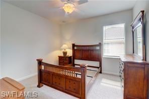 Image 4: Bedroom featuring ceiling fan and light carpet