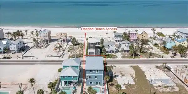 Image 2: Direct beach access, a private swimming pool, and a multi-story design