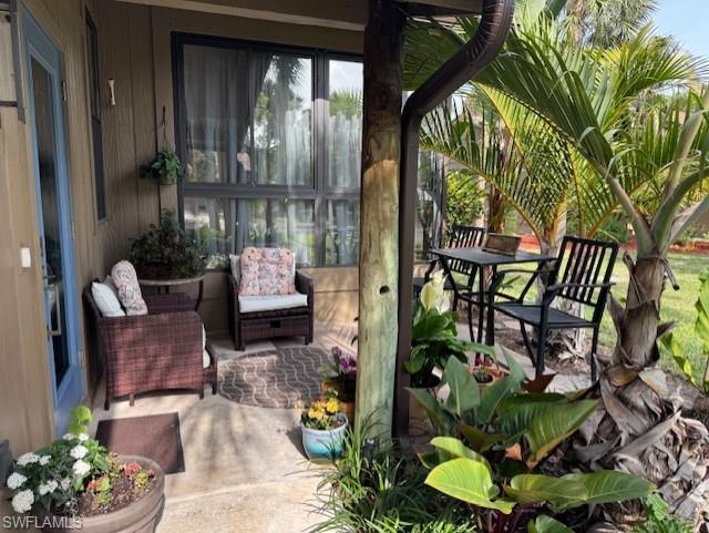 Image 2: Main Side Entrance and patio/setting area