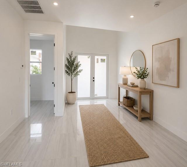 Image 3: Inviting foyer with abundant natural light and elegant finishes.