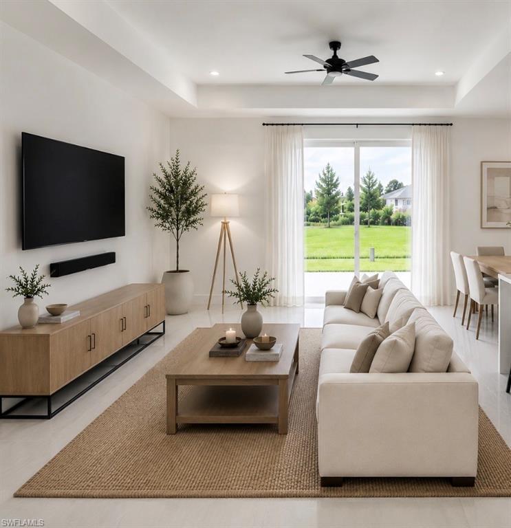 Image 4: Spacious open living room featuring vaulted ceilings and seamless flow to the kitchen.