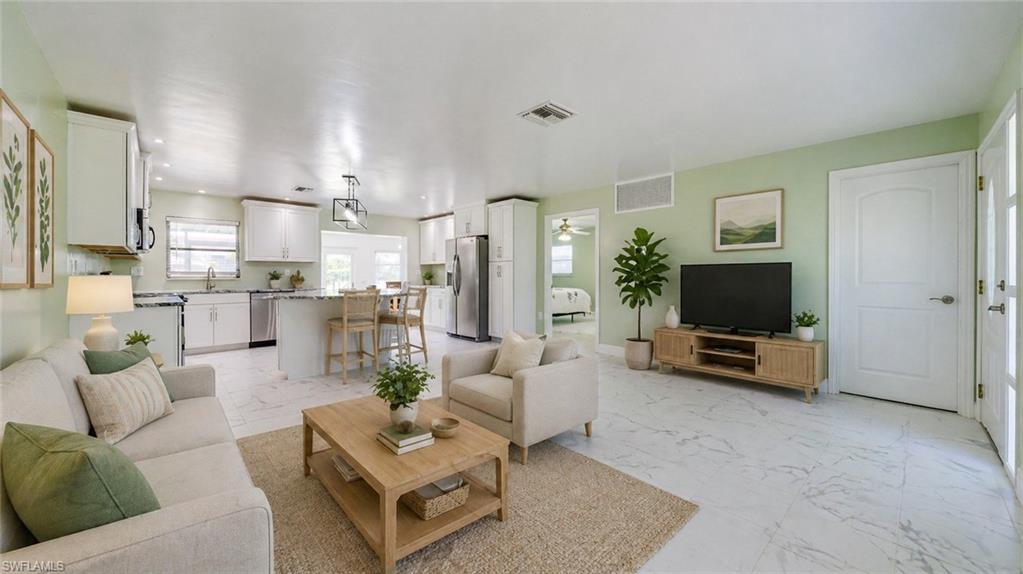 Image 4: Virtually Staged - Great Room with View of Kitchen