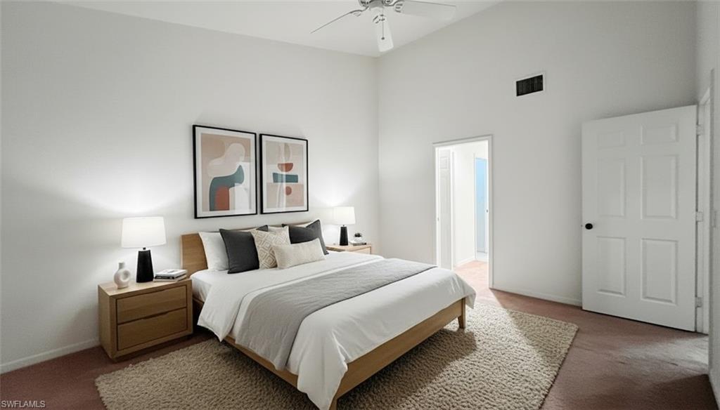 Image 2: Bedroom with carpet floors, a high ceiling, and ceiling fan