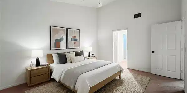 Image 2: Bedroom with carpet floors, a high ceiling, and ceiling fan