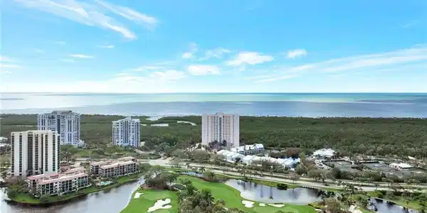 Image 2: Bird's eye view of a nearby body of water and a golf course