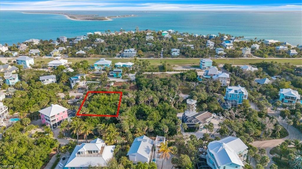 Image 2: Aerial view of lot (outlined in red) nestled among established island homes &mdash; just a short walk to the North Captiva airstrip and surrounded by the island's most desirable residential neighborhood.