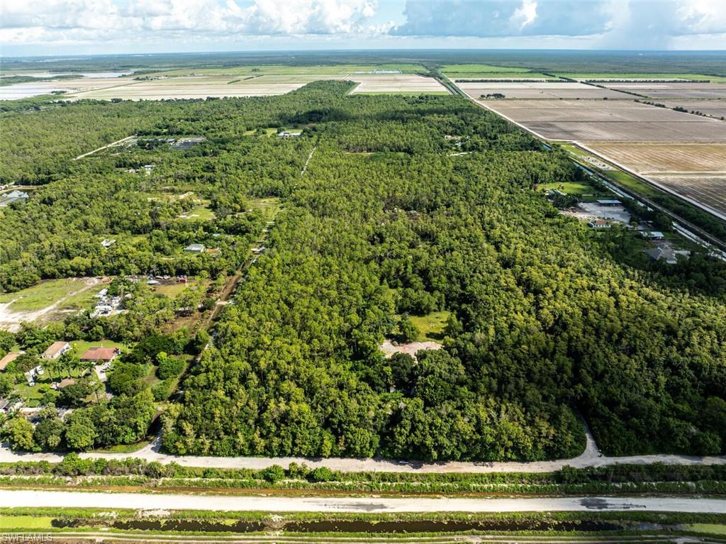 Image 1: Aerial view of property and surrounding area with rural landscape and extensive farmland