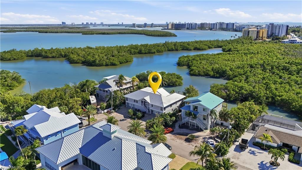 Image 4: Aerial view of skyline and a nearby body of water - Virtually Edited Image