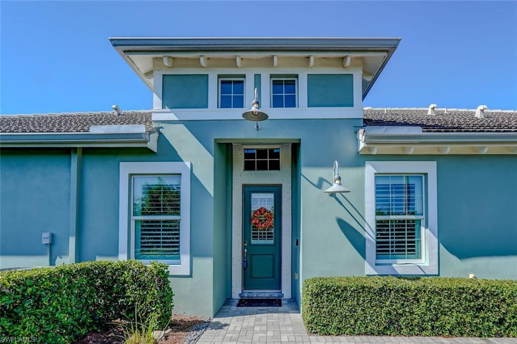 Image 2: Doorway to property featuring stucco siding