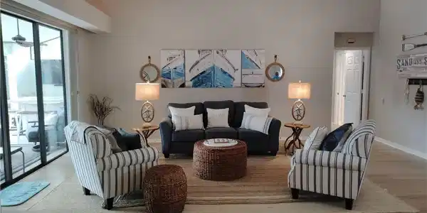 Image 4: Living room featuring a ceiling fan, wood finished floors, and a high ceiling