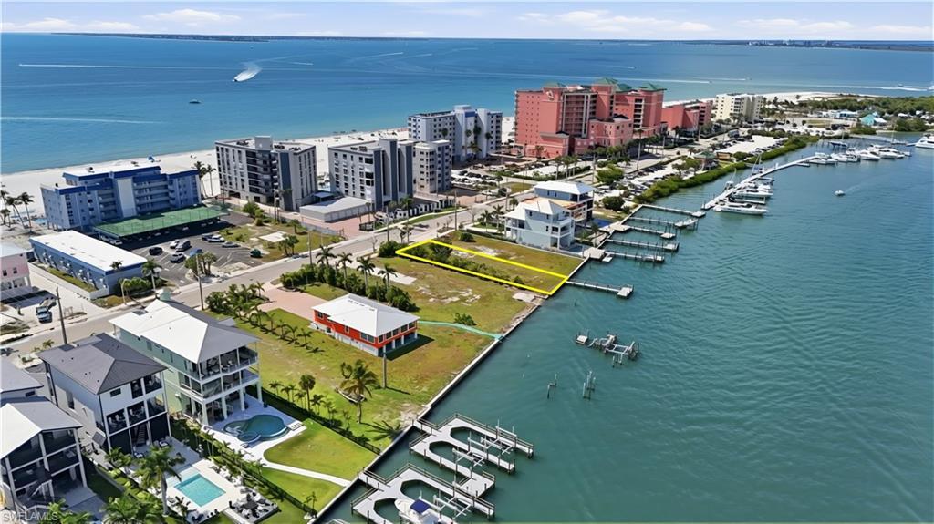 Image 1: View of urban area with a nearby body of water and numerous boat docks - Virtually Edited Image