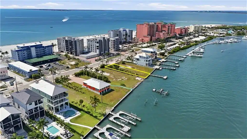 Image 1: View of urban area with a nearby body of water and numerous boat docks - Virtually Edited Image